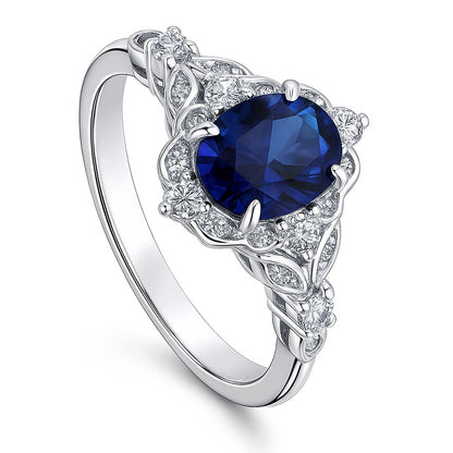 Halo Art Deco Sapphire-Blue Oval CZ Ring in Sterling Silver
