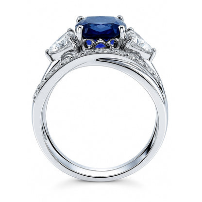 3-Stone Criss Cross Sapphire-Blue CZ Ring Set in Sterling Silver