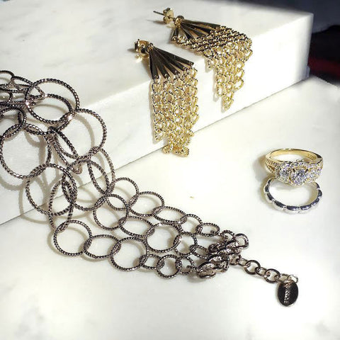 Image Contain: 3-Stone Ring, Bead Band, Fringe Chandelier Earrings, Open Circle Link Bracelet