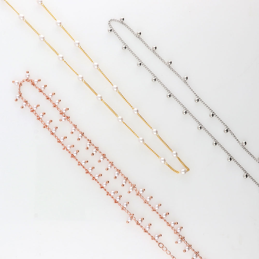 Flatlay view of Bead Station Necklace, Rose Gold Plated