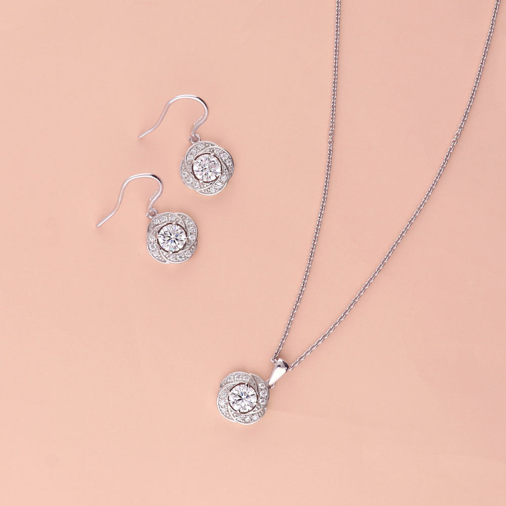 Image Contain: Flower Dangle Earrings, Flower Pendant Necklace