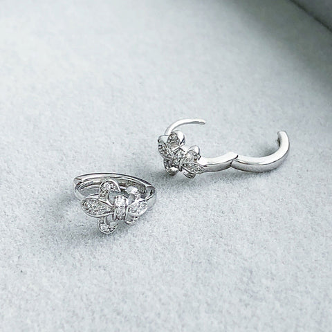 Image Contain: Fleur De Lis Huggie Earrings