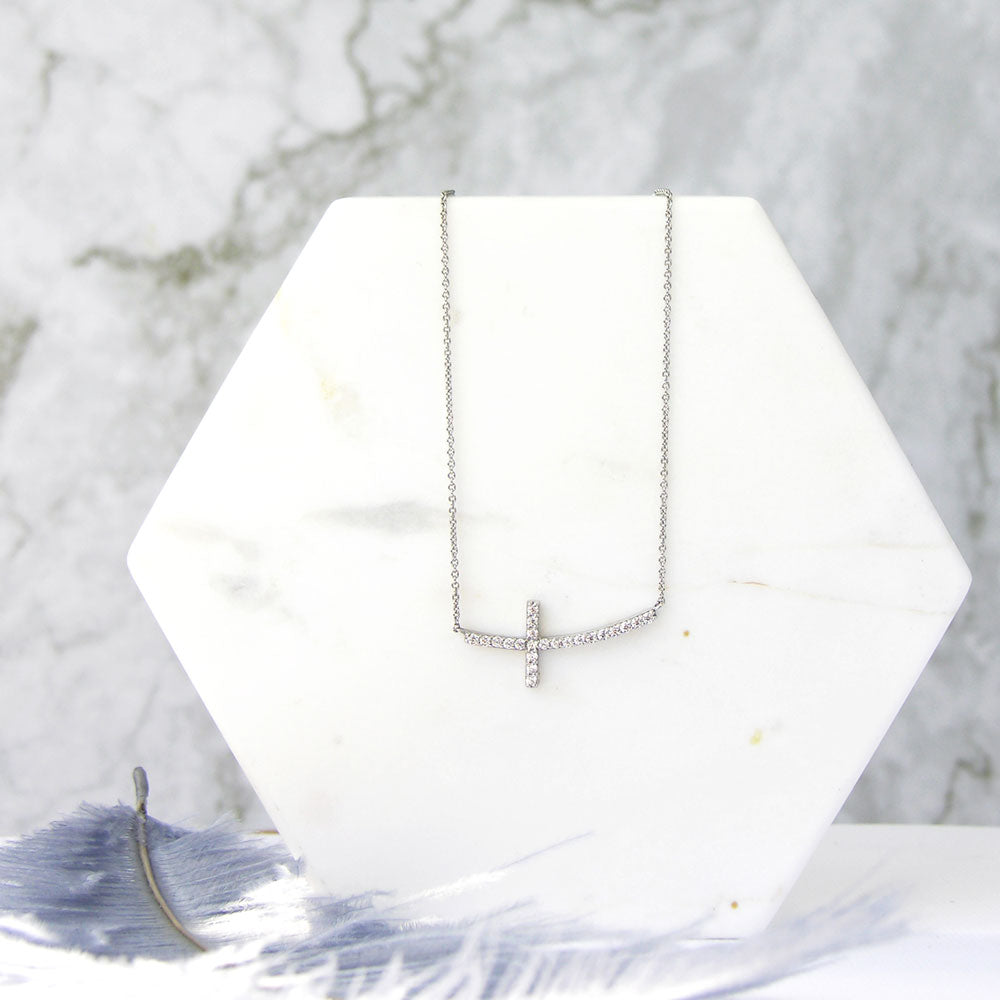 Flatlay view of Sideways Cross CZ Necklace in Sterling Silver, 7 of 9