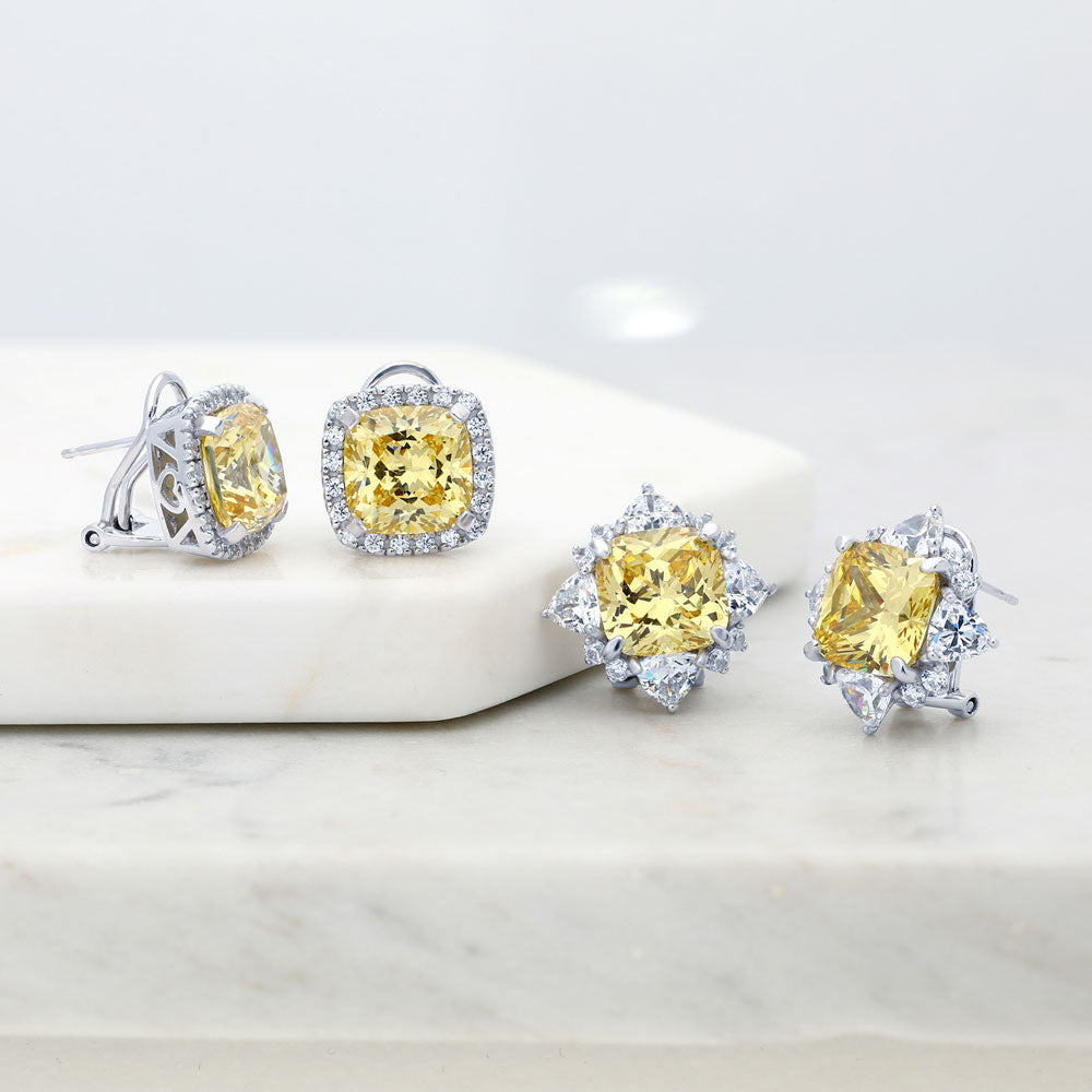 Flatlay view of Halo Canary Yellow CZ Omega Back Stud Earrings in Sterling Silver, 3 of 5