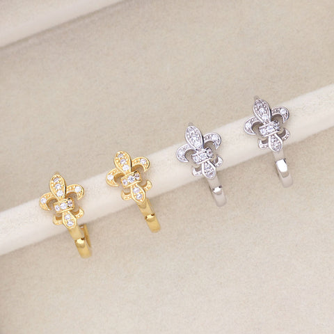Image Contain: Fleur De Lis Huggie Earrings