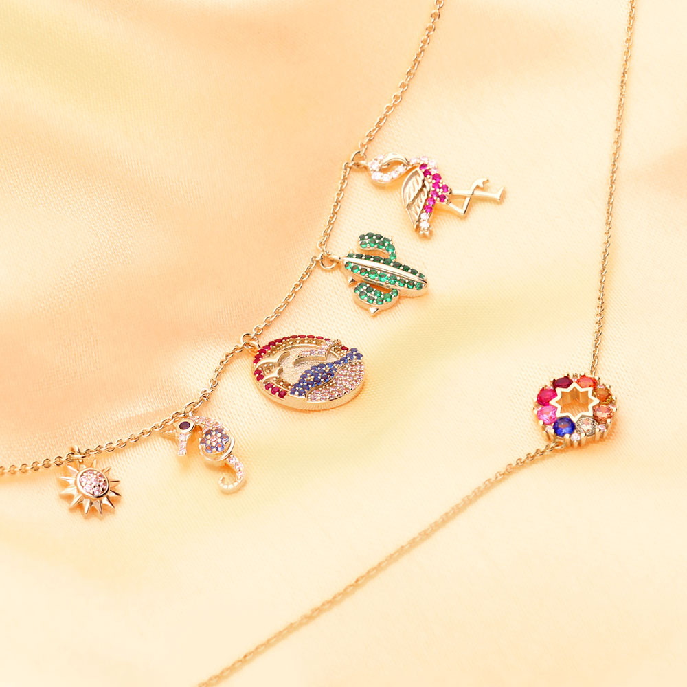 Image Contain: Star Charm Bracelet, Wreath Chain Bracelet