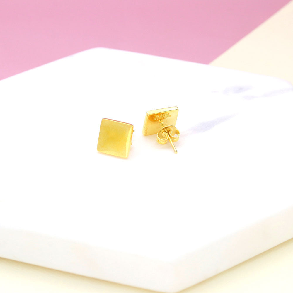 Flatlay view of Square Stud Earrings in Sterling Silver, Yellow Gold Flashed