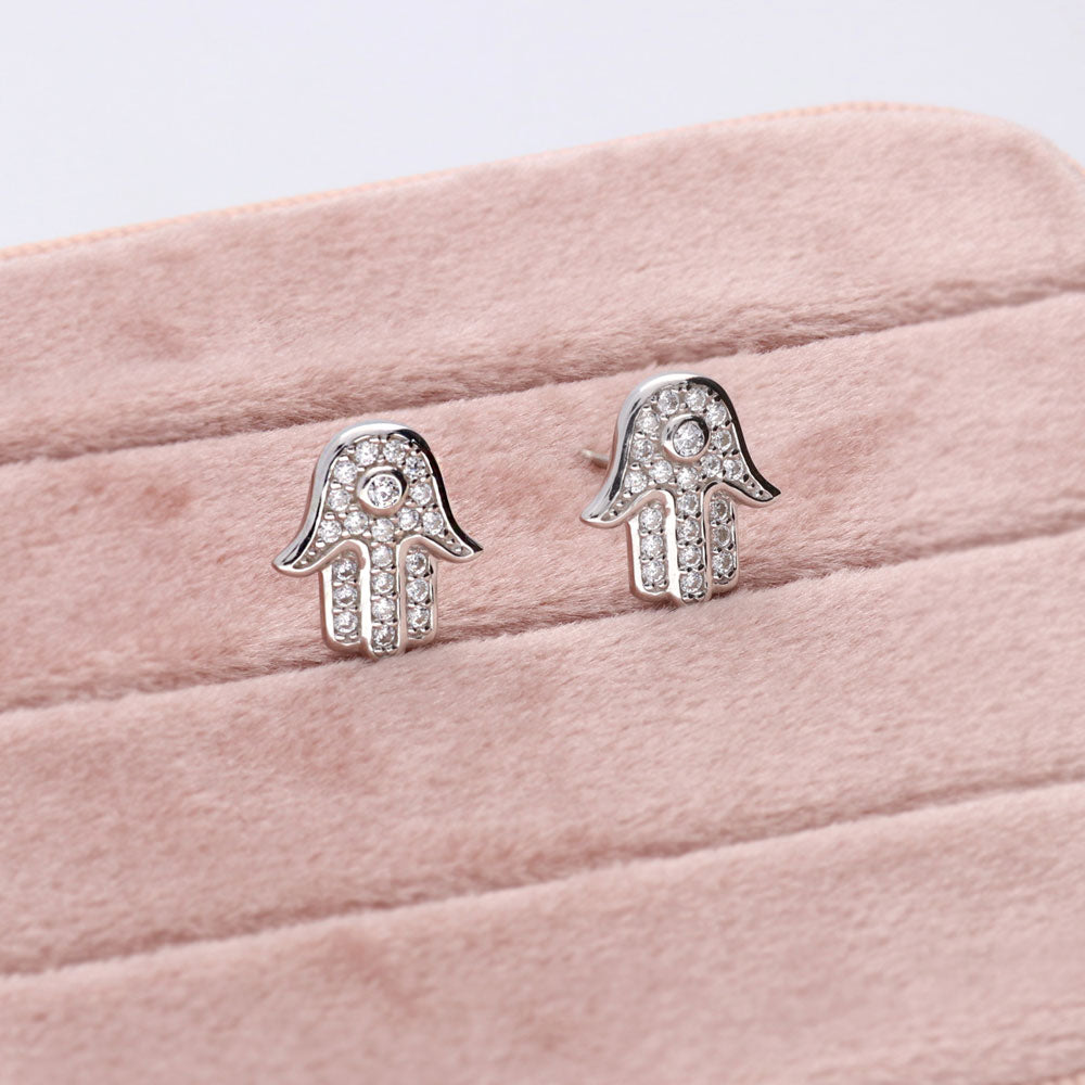 Flatlay view of Hamsa Hand CZ Stud Earrings in Sterling Silver, 5 of 7