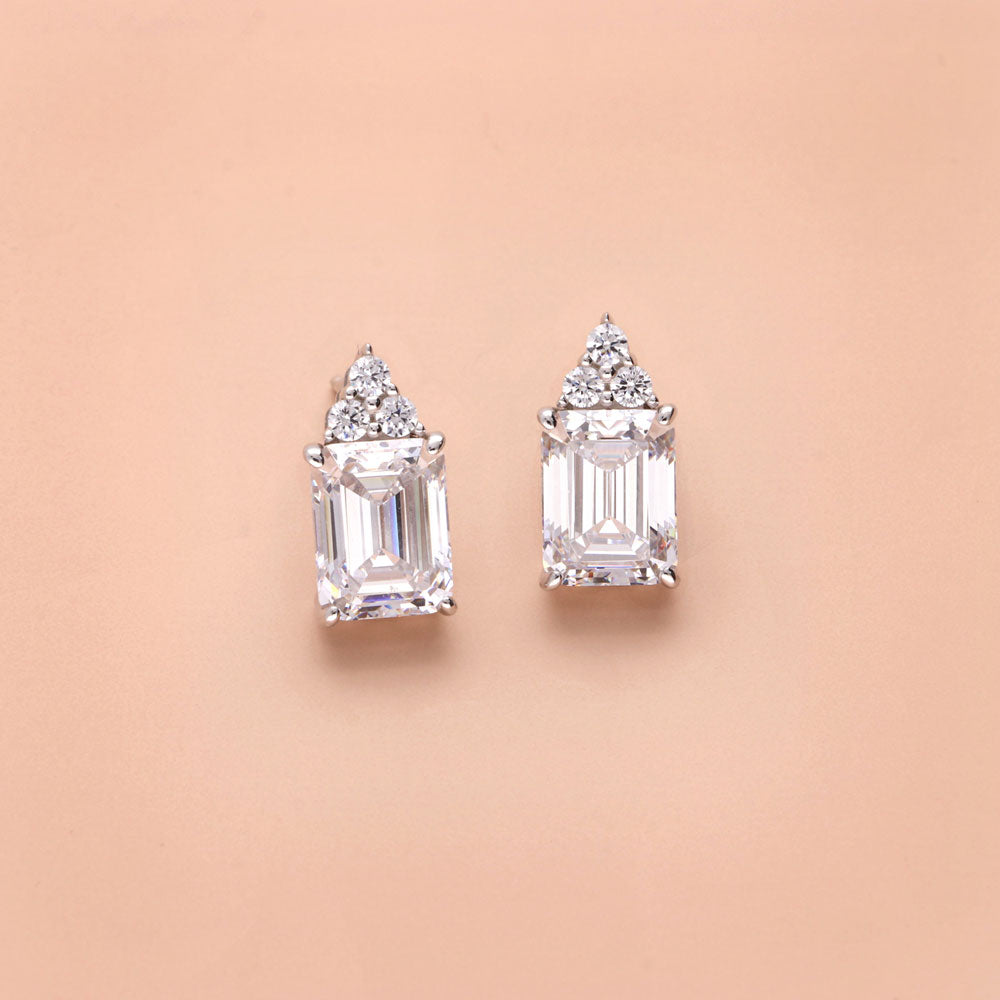 Flatlay view of Solitaire 4.2ct Emerald Cut CZ Stud Earrings in Sterling Silver, 6 of 7