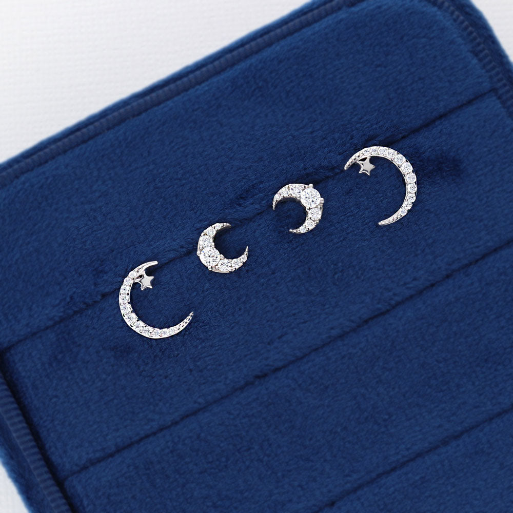 Flatlay view of Crescent Moon CZ Stud Earrings in Sterling Silver, 7 of 9