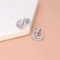 Flatlay view of Cluster Wrap CZ Stud Earrings in Sterling Silver, Rhodium Plated