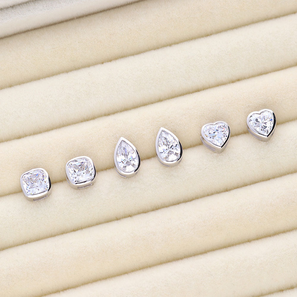Flatlay view of Solitaire 1.6ct Bezel Pear CZ Stud Earrings in Sterling Silver, 6 of 6
