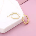 Flatlay view of Hexagon CZ Inside-Out Hoop Earrings in Sterling Silver 0.8 inch, Yellow Gold Flashed