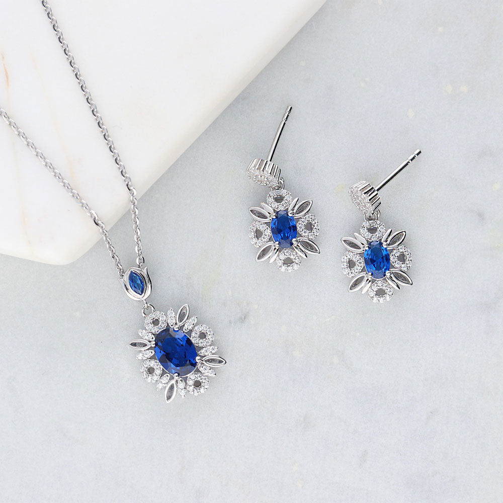 Image Contain: Flower Dangle Earrings, Flower Pendant Necklace