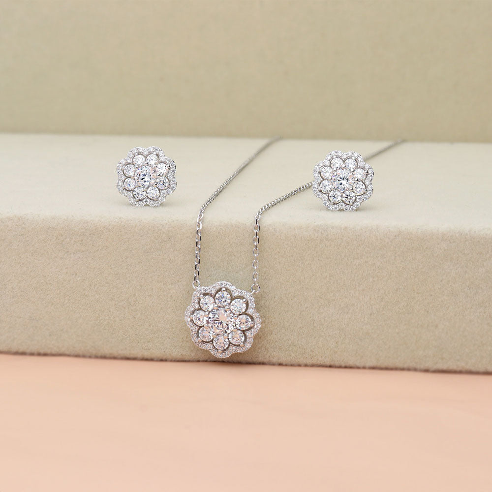 Flatlay view of Flower Halo CZ Stud Earrings in Sterling Silver, 7 of 7