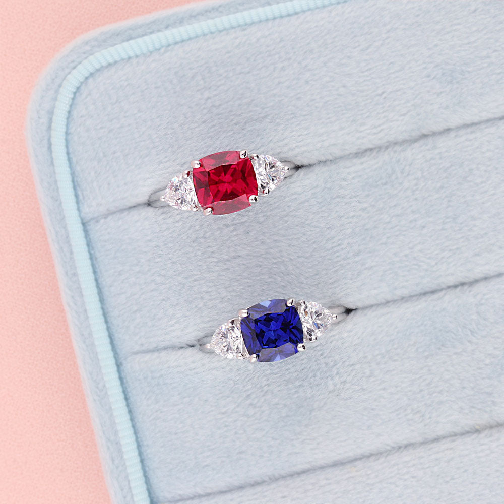 Flatlay view of 3-Stone 3ct Ruby-Red Cushion CZ Ring in Sterling Silver, 3 of 9