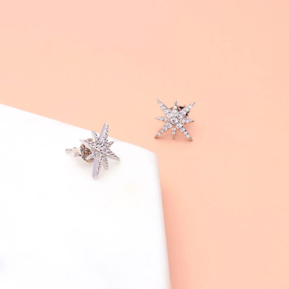 Flatlay view of North Star CZ Necklace and Earrings in Sterling Silver, Yellow Gold Flashed