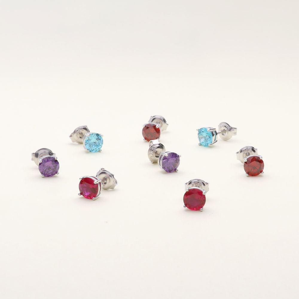 Flatlay view of Solitaire CZ Stud Earrings in Sterling Silver 1.6ct, Garnet Color