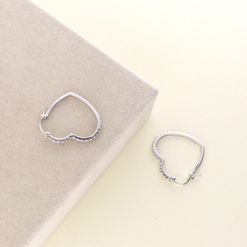 Flatlay view of Heart CZ Small Hoop Earrings in Sterling Silver 1 inch, 5 of 5