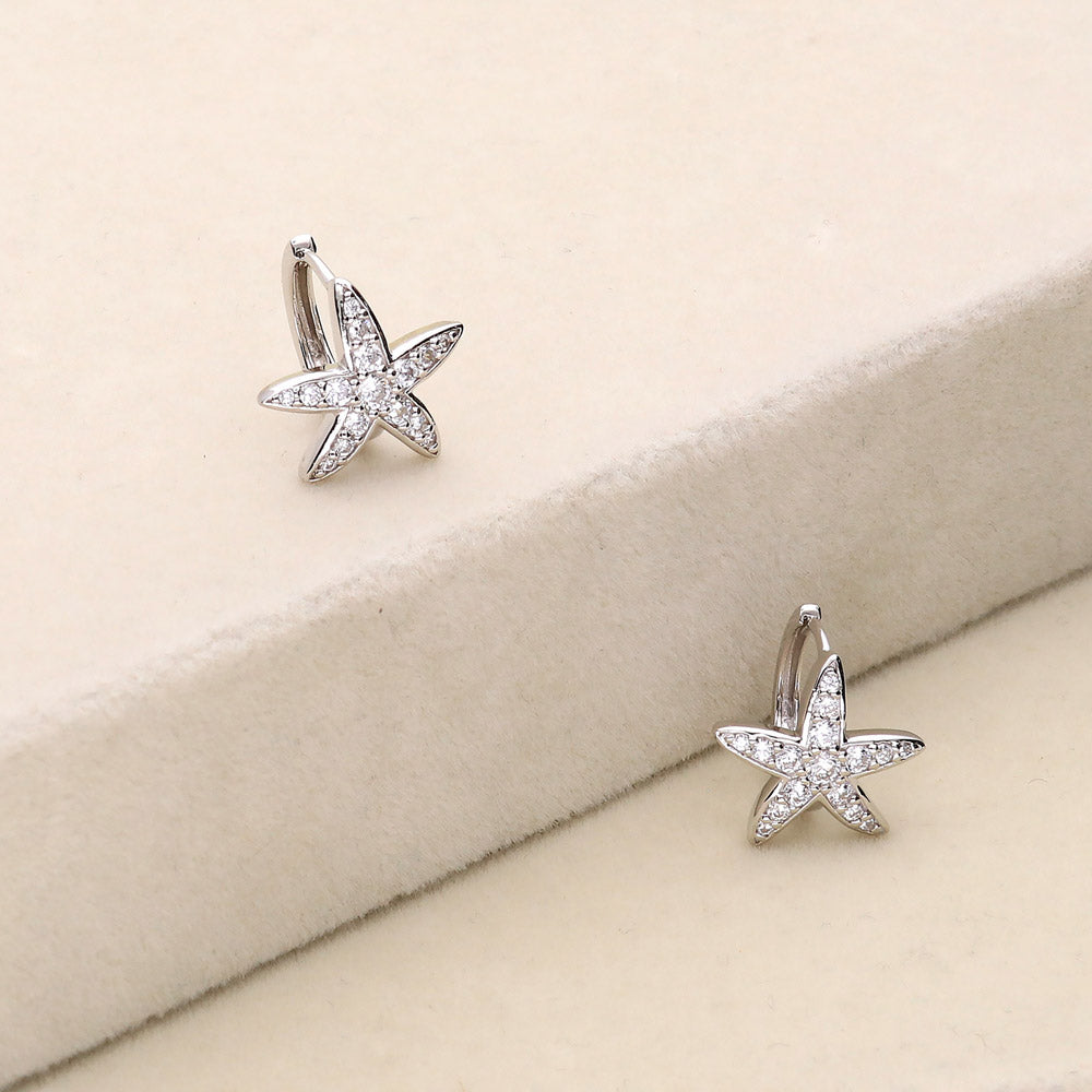 Flatlay view of Starfish CZ Mini Huggie Earrings in Sterling Silver 0.5 inch, 3 of 5