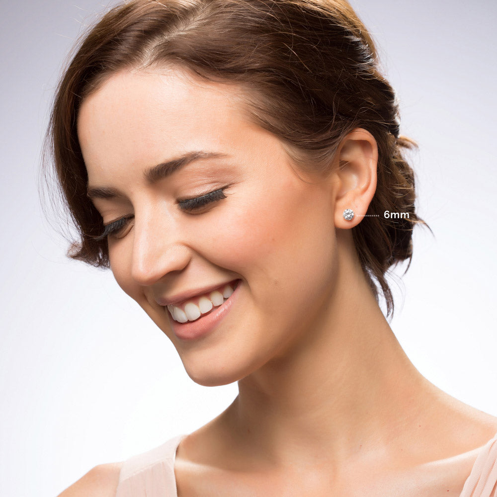 Model wearing Solitaire CZ Stud Earrings in Sterling Silver, 6mm