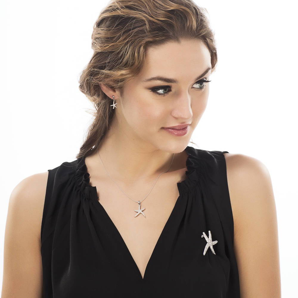 Model wearing Starfish CZ Dangle Earrings in Sterling Silver, 3 of 3