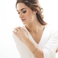 Model wearing Solitaire 0.45ct Bezel CZ Necklace in Sterling Silver, Yellow Gold Flashed