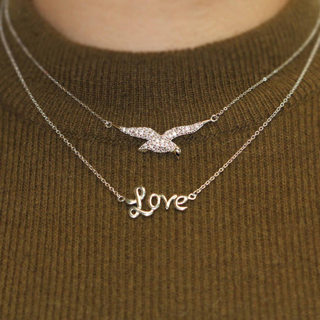Image Contain: Model Wearing Bird Pendant Necklace, Love Pendant Necklace