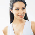 Model wearing Anchor Stud Earrings in Sterling Silver, Yellow Gold Flashed