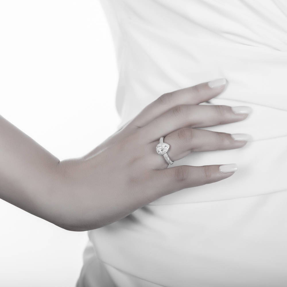 Model wearing Halo Pear Cut CZ Ring in Sterling Silver, 2 of 6