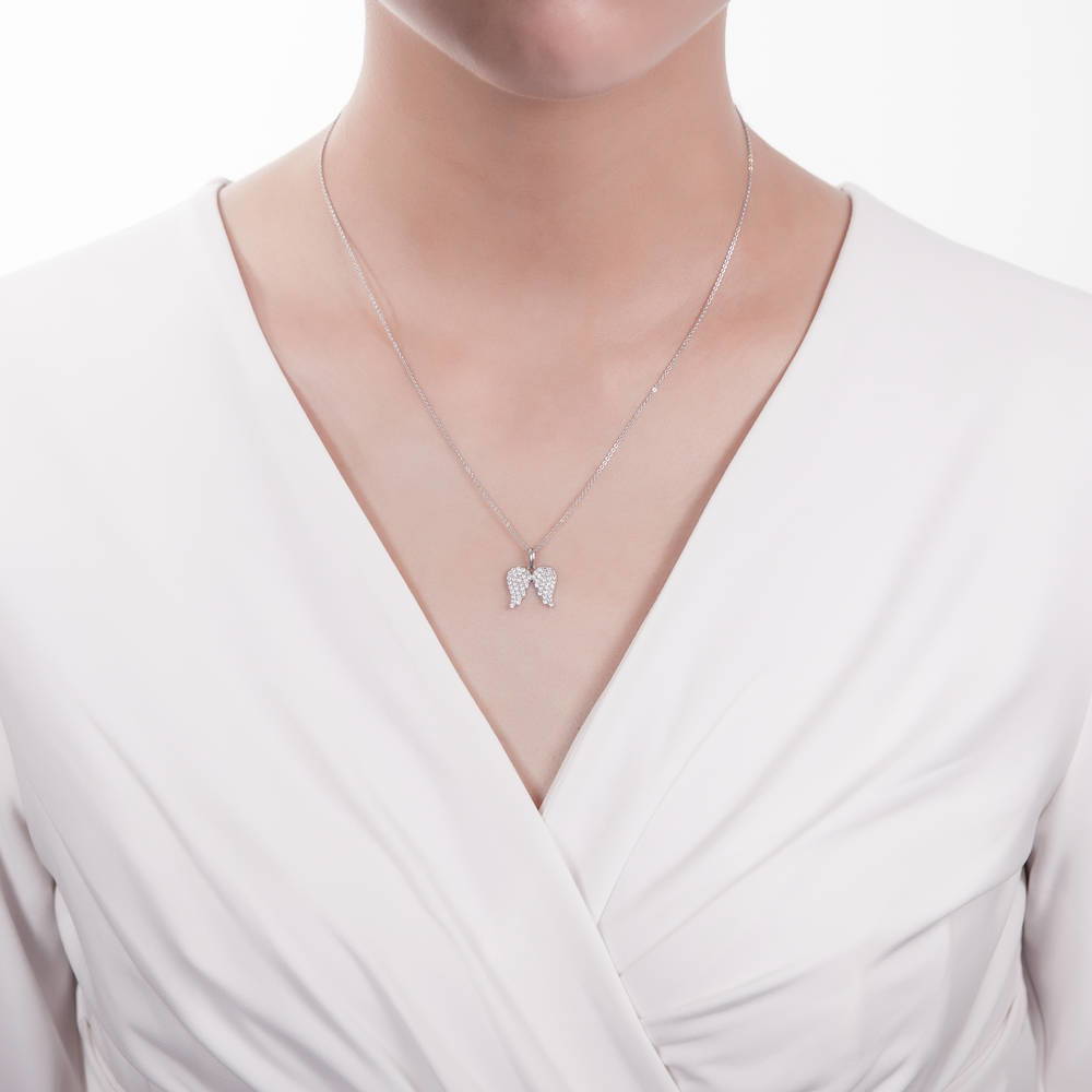 Model wearing Angel Wings CZ Necklace in Sterling Silver, 2 of 7