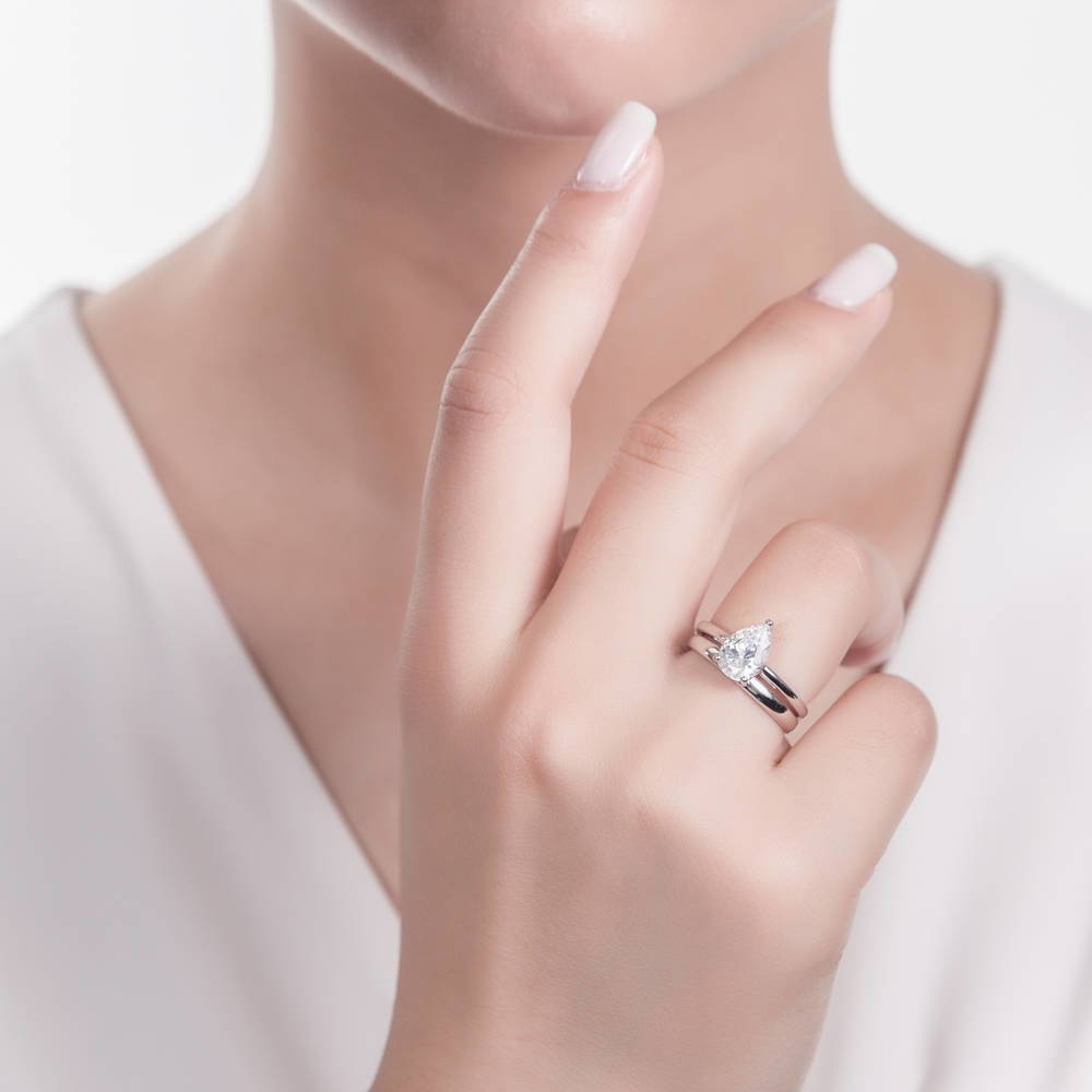 Model wearing Solitaire 1.8ct Pear CZ Ring Set in Sterling Silver, 2 of 11