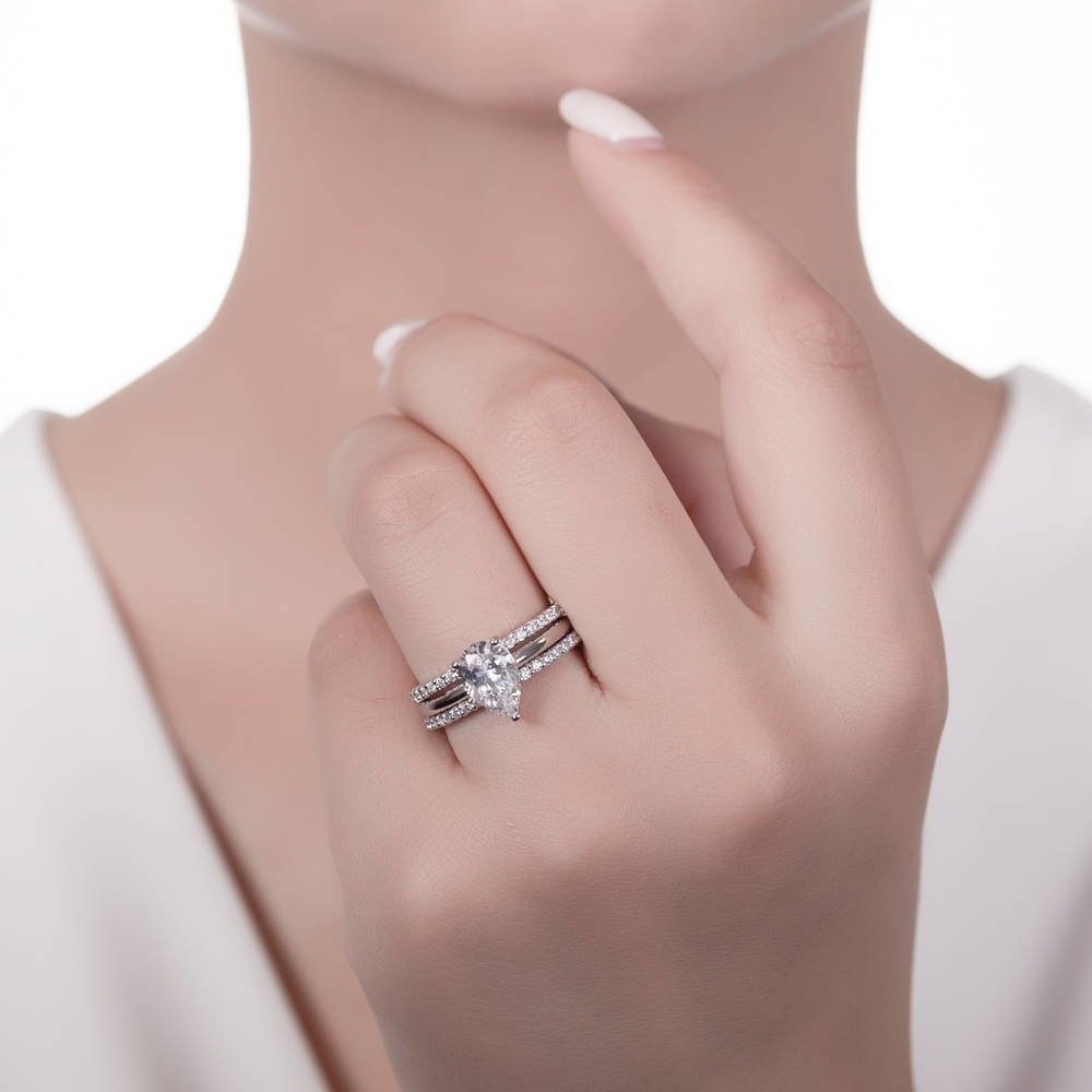 Model wearing Solitaire 1.8ct Pear CZ Ring Set in Sterling Silver, 2 of 16
