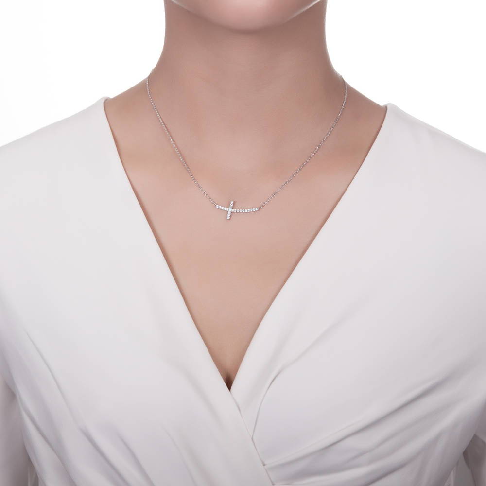 Model wearing Sideways Cross CZ Necklace in Sterling Silver, 6 of 9