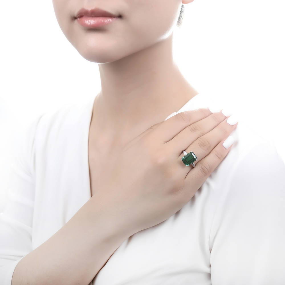 Model wearing Solitaire Emerald-Green Emerald Cut CZ Ring in Sterling Silver, 2 of 10