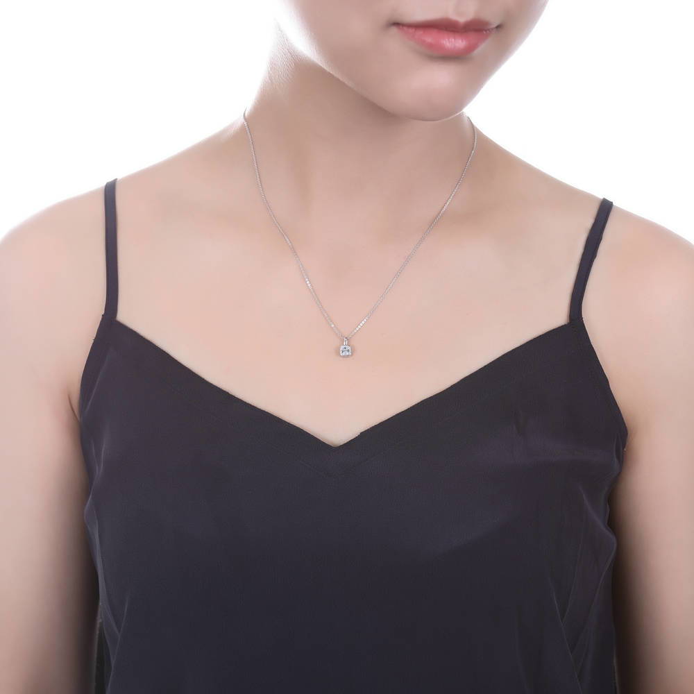 Model wearing Solitaire 0.6ct Bezel Cushion CZ Necklace in Sterling Silver, 3 of 5