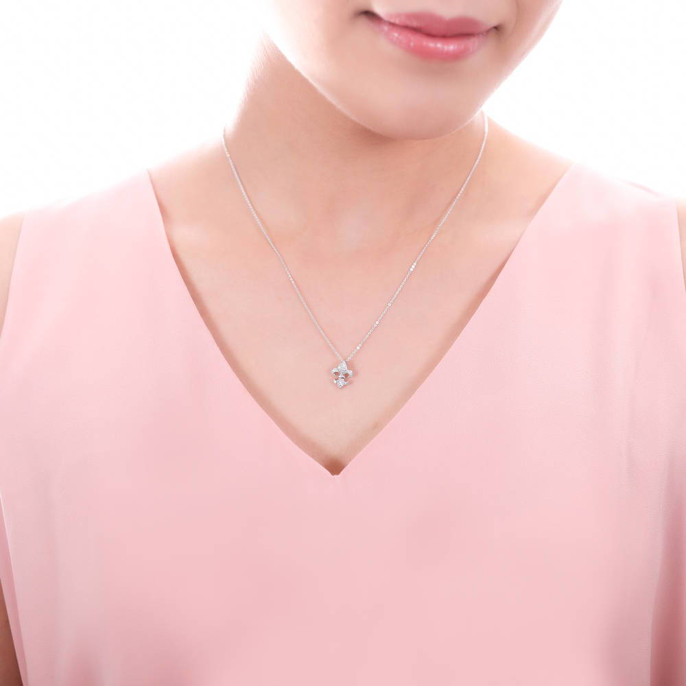 Model wearing Fleur De Lis CZ Necklace and Earrings in Sterling Silver, 13 of 14