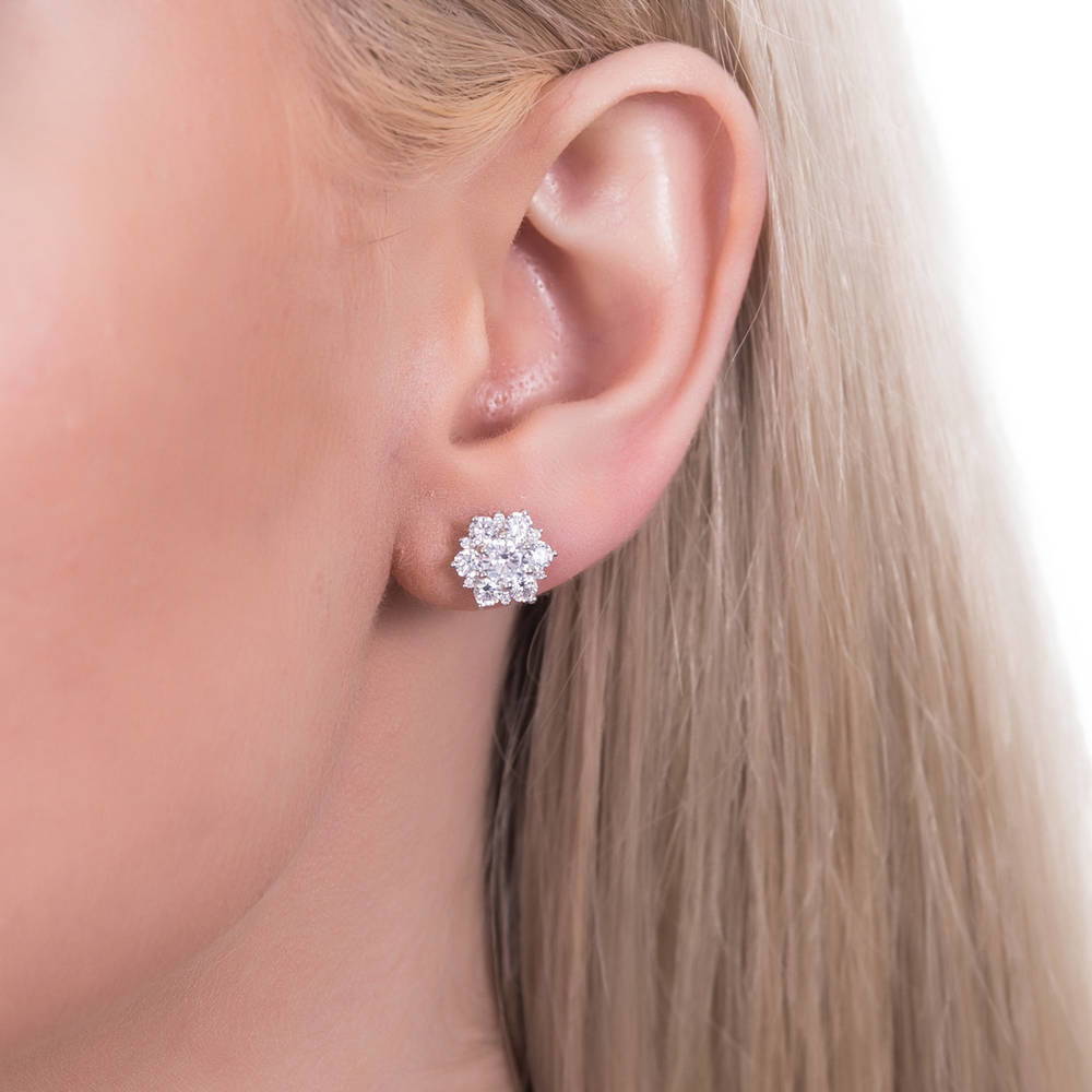 Model wearing Flower Halo CZ Stud Earrings in Sterling Silver, 5 of 9