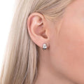 Model wearing Dome Mini Huggie Earrings in Sterling Silver 0.45 inch, Yellow Gold Flashed