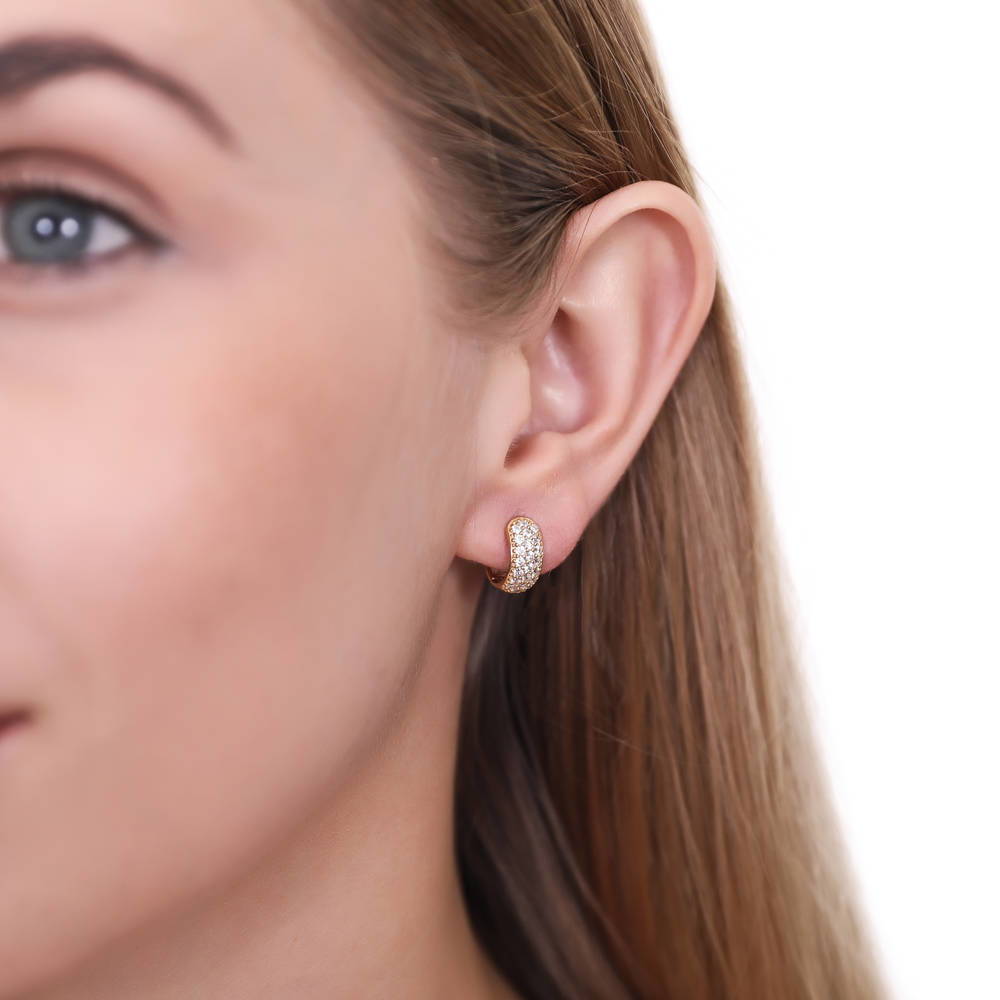 Model wearing Dome CZ Huggie Earrings in Gold Flashed Sterling Silver, 2 Pairs, 10 of 11