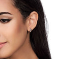 Model wearing Dome Small Huggie Earrings in Sterling Silver 0.5 inch, Yellow Gold Flashed