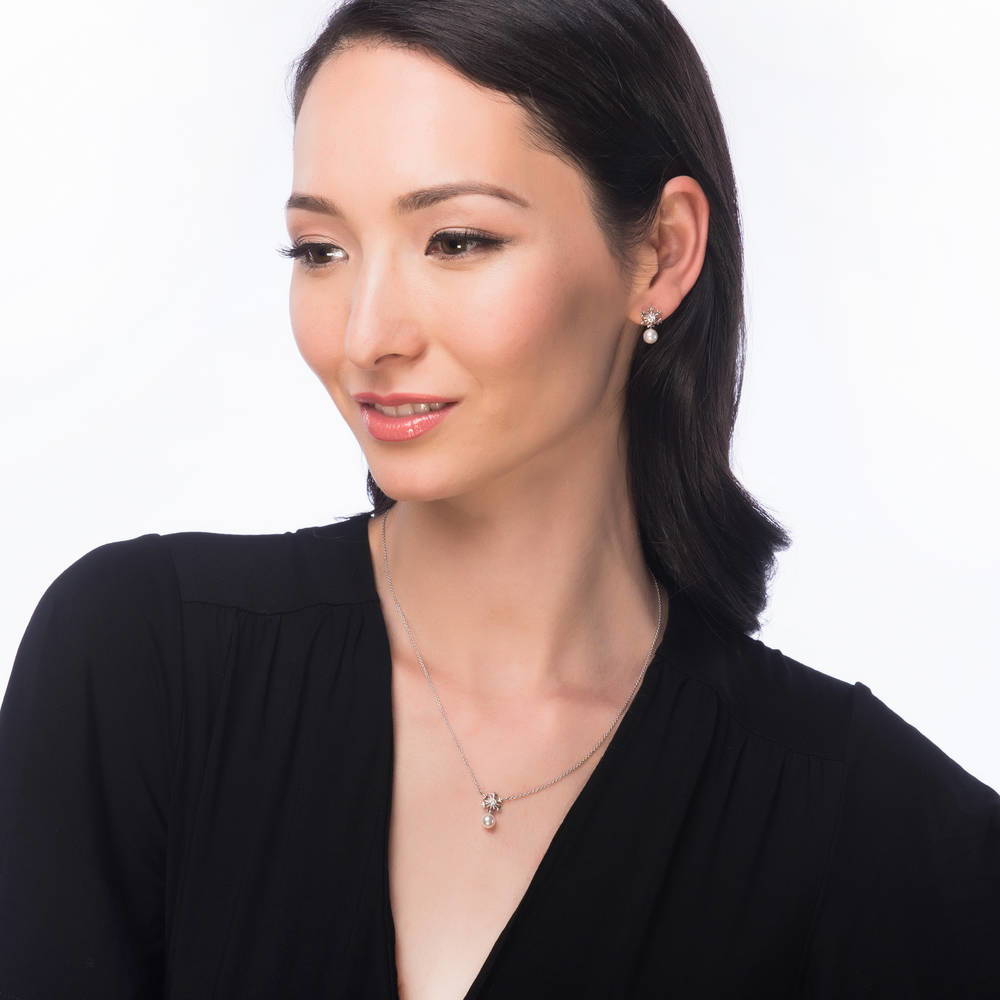 Model wearing Snowflake Imitation Pearl Necklace in Sterling Silver, 3 of 5