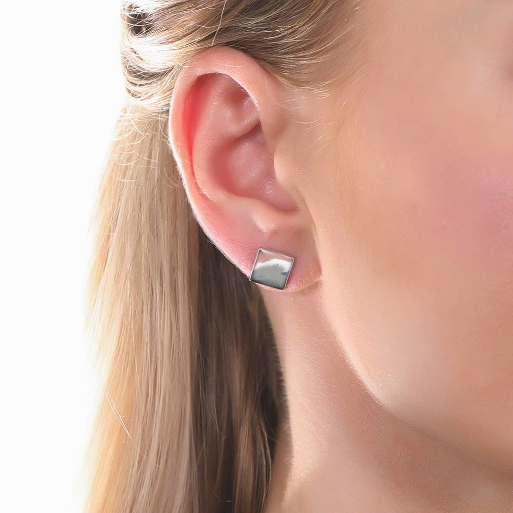 Model wearing Cross Square Stud Earrings in Sterling Silver, 2 Pairs, 2 of 11