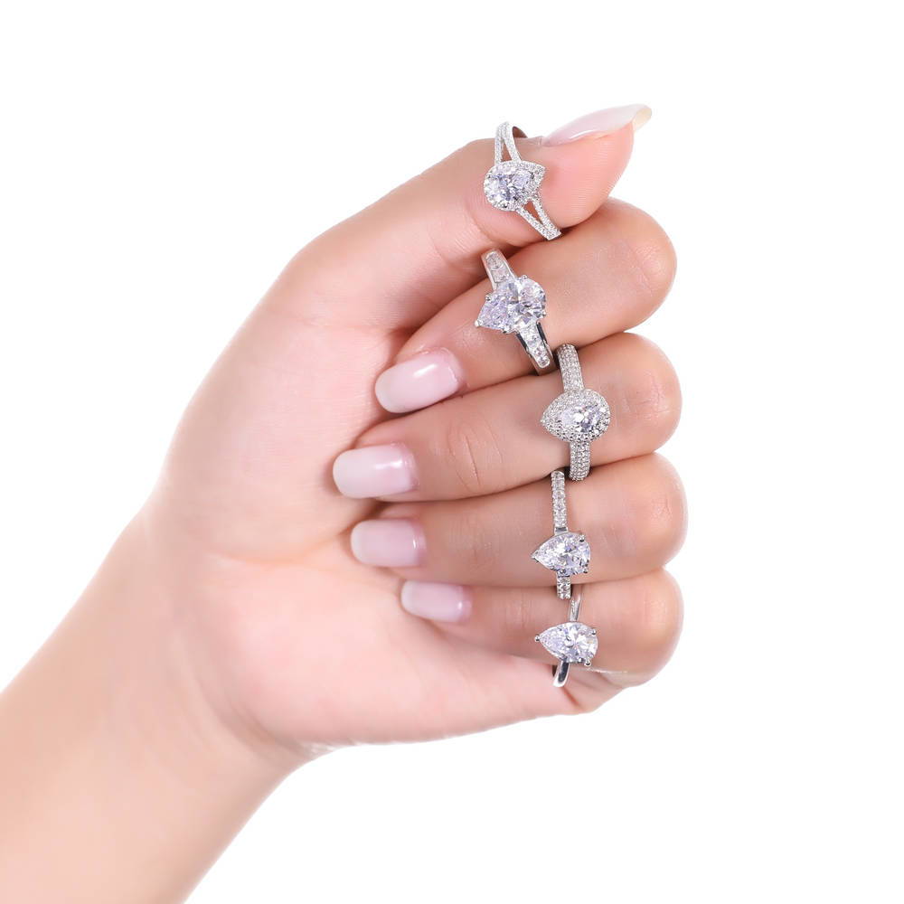 Model wearing Halo Pear Cut CZ Ring in Sterling Silver, 3 of 6