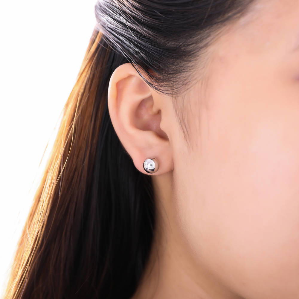 Model wearing Ball Bead Stud Earrings in Sterling Silver, 2 of 4