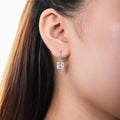 Model wearing Solitaire 4ct Princess CZ Leverback Earrings in Sterling Silver, Rhodium Plated