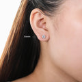 Model wearing Solitaire CZ Stud Earrings in Gold Flashed Sterling Silver, 6mm