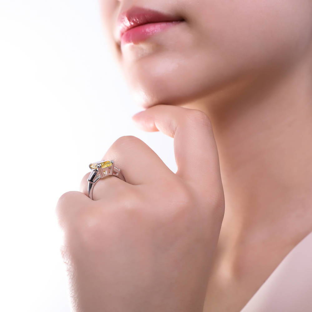 Model wearing 3-Stone 9ct Canary Yellow Cushion CZ Ring in Sterling Silver, 6 of 10