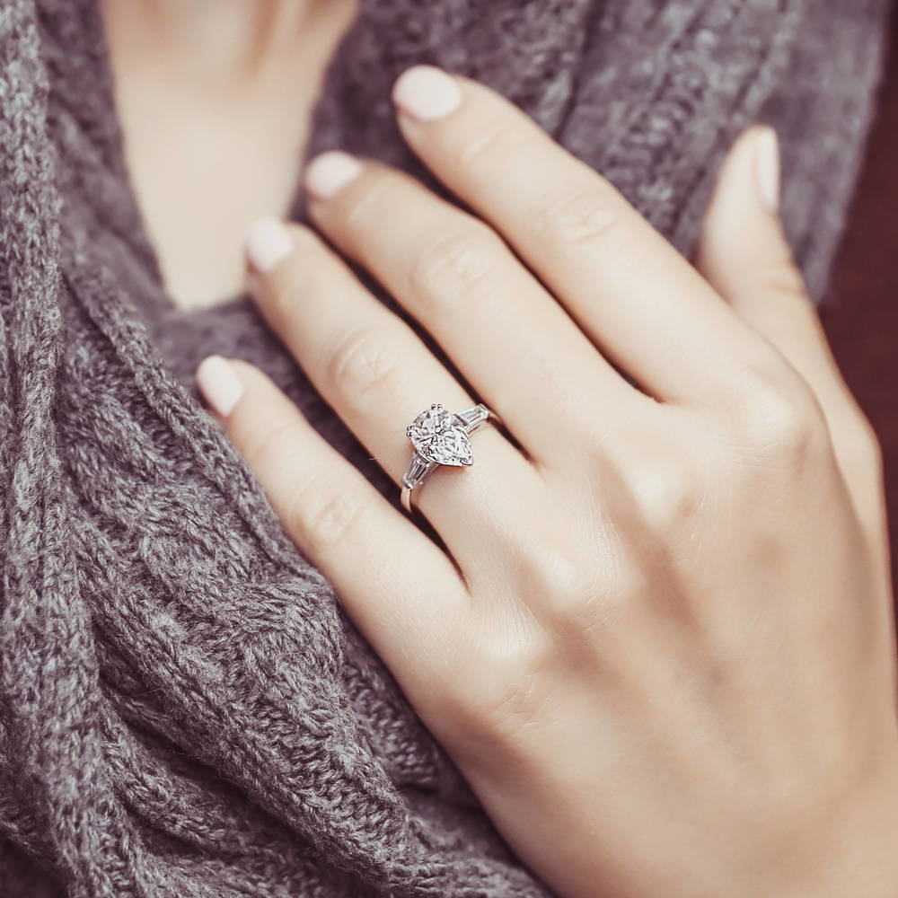 Model wearing Solitaire 1.8ct Pear CZ Ring in Sterling Silver, 2 of 8