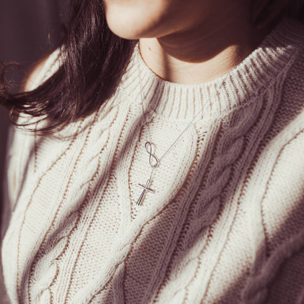 Model wearing Infinity Cross Lariat Necklace in Sterling Silver, 2 of 7